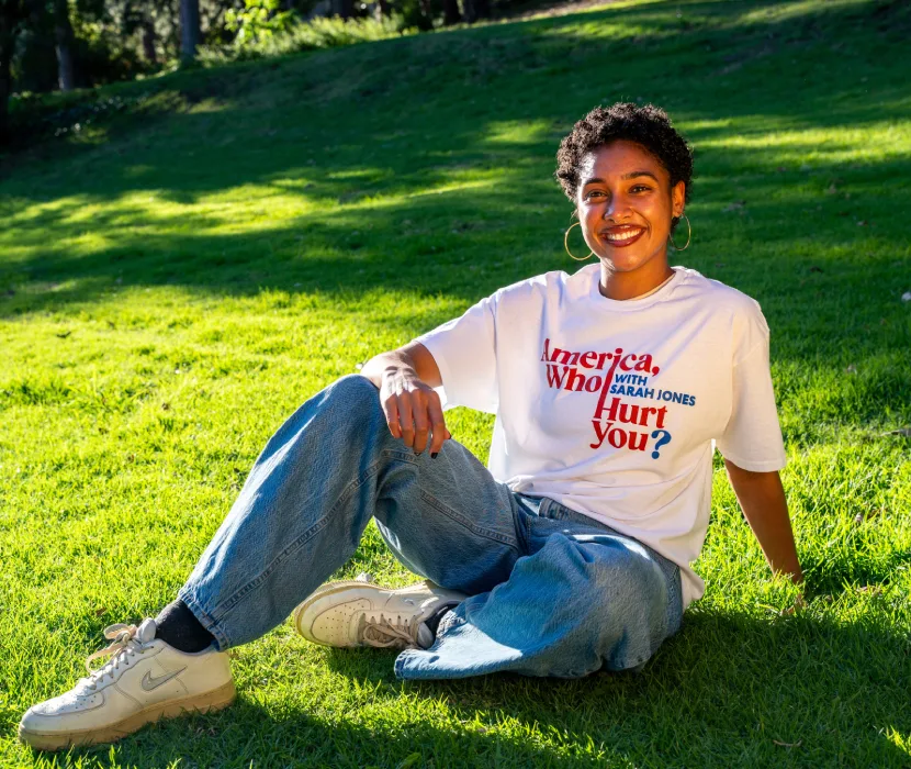 Woman in park wearing slogan t-shirt